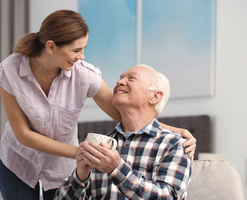 Man with coffee and Caregiver